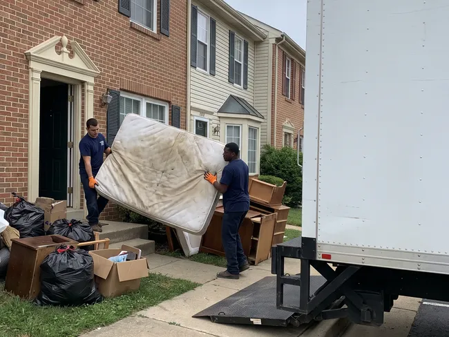 Junk removal crew at a home in Dumfries, VA